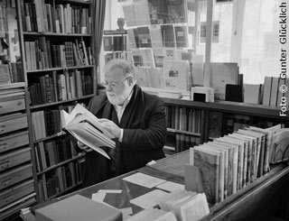Alberto Manguel in a bookshop